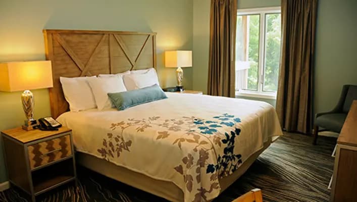 Bedroom with king bed at Woodstone at Massanutten Resort